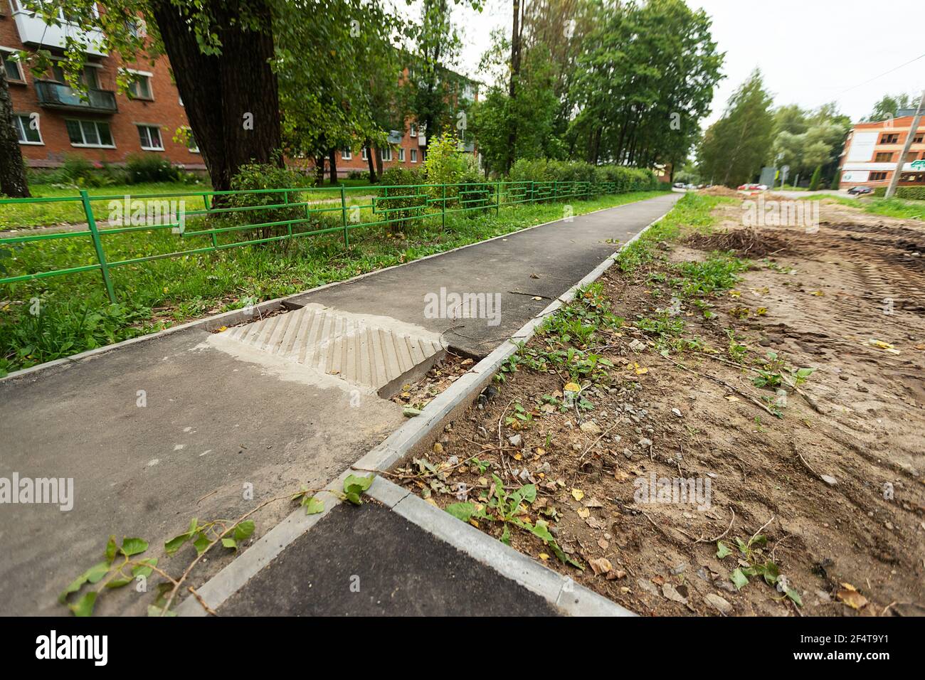 Road Execution poorly executed road repairs. replacing the old curb stone with a new ...