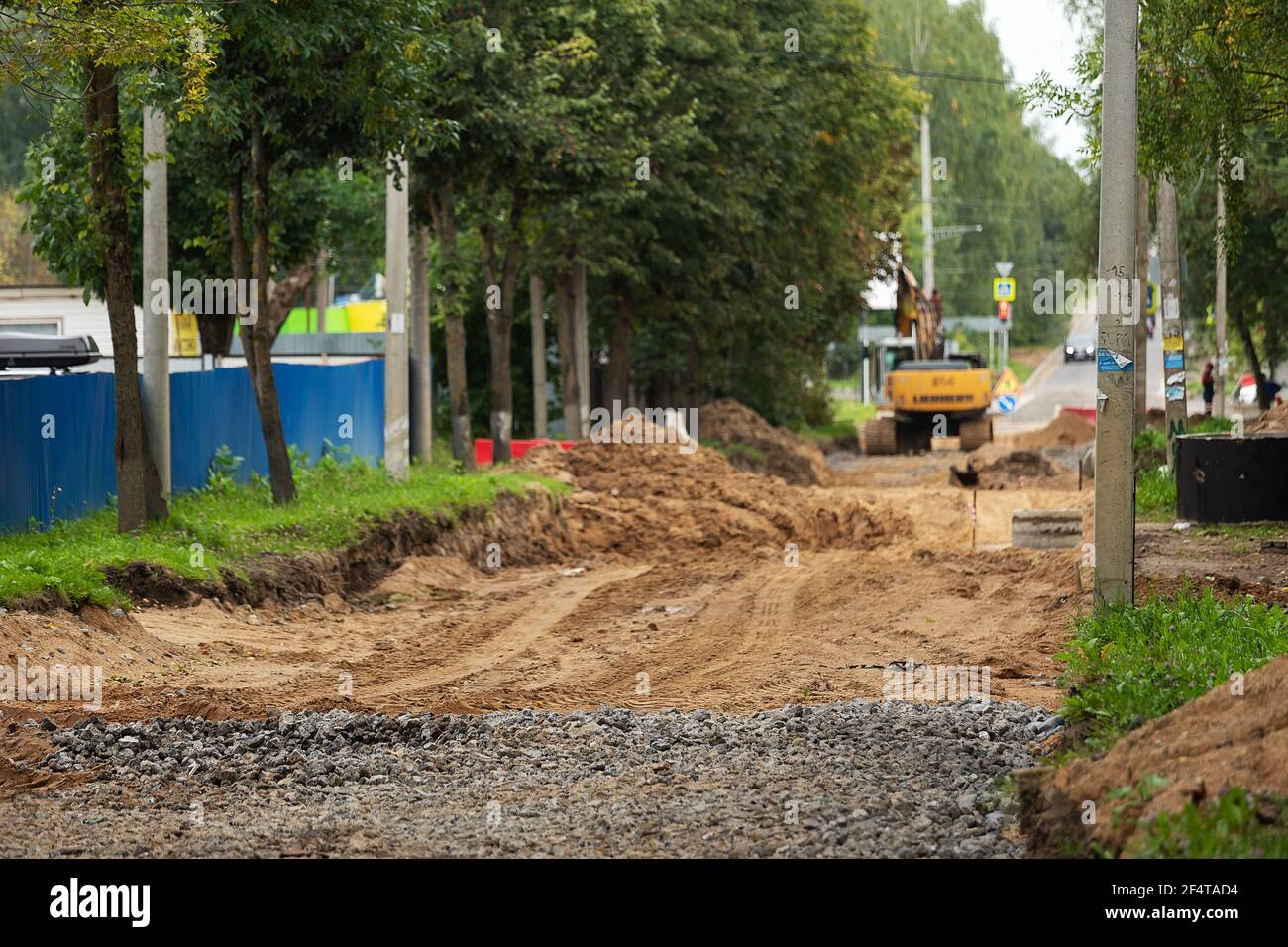 poorly executed road repairs. replacing the old curb stone with a new one Stock Photo