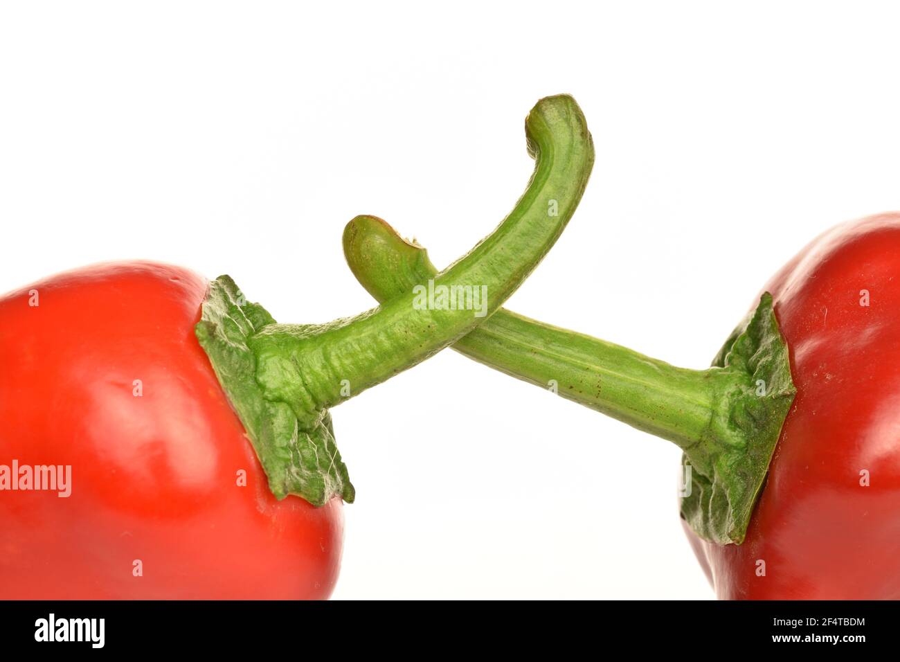 Parts of two whole ripe organic tasty sweet Kapia peppers, in focus ...
