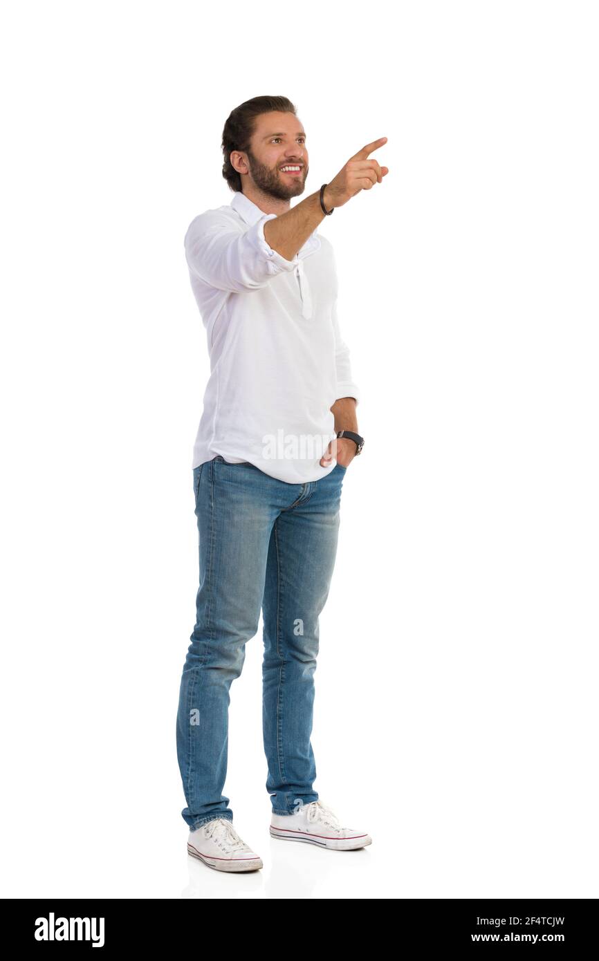 Casual happy man in white shirt, jeans 