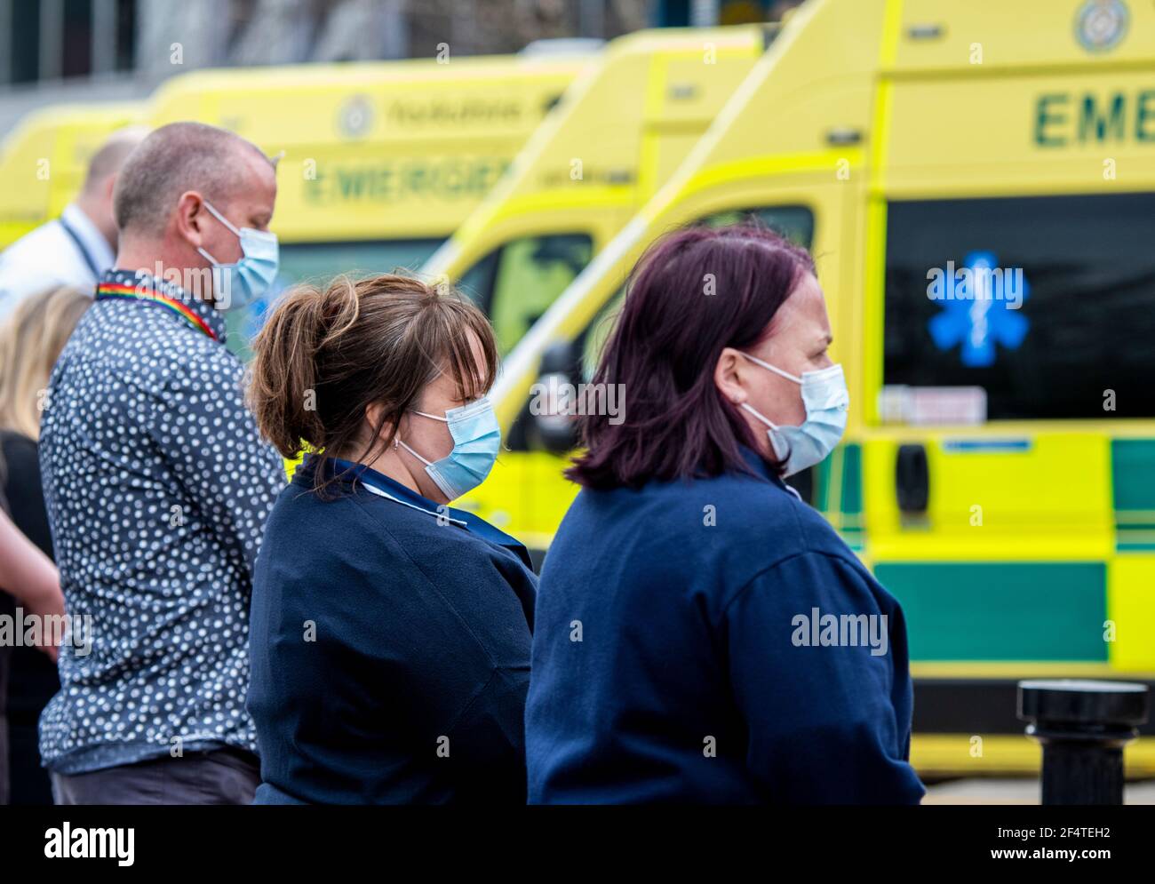 Harrogate, UK. 23rd Mar, 2021. NHS staff observe one minute of silence outside the district hospital to mark one year since the start of the first lockdown and remember all the victims of Covid 19. Credit: ernesto rogata/Alamy Live News Stock Photo