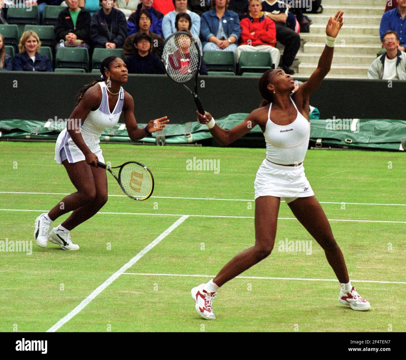 Venus Williams and Serena Williams at Wimbledon July 2000playing in Doubles semi final against Natasha Zvereva and Anna Kournikova   The Williams sisters won the match 6-3 7-6 Stock Photo