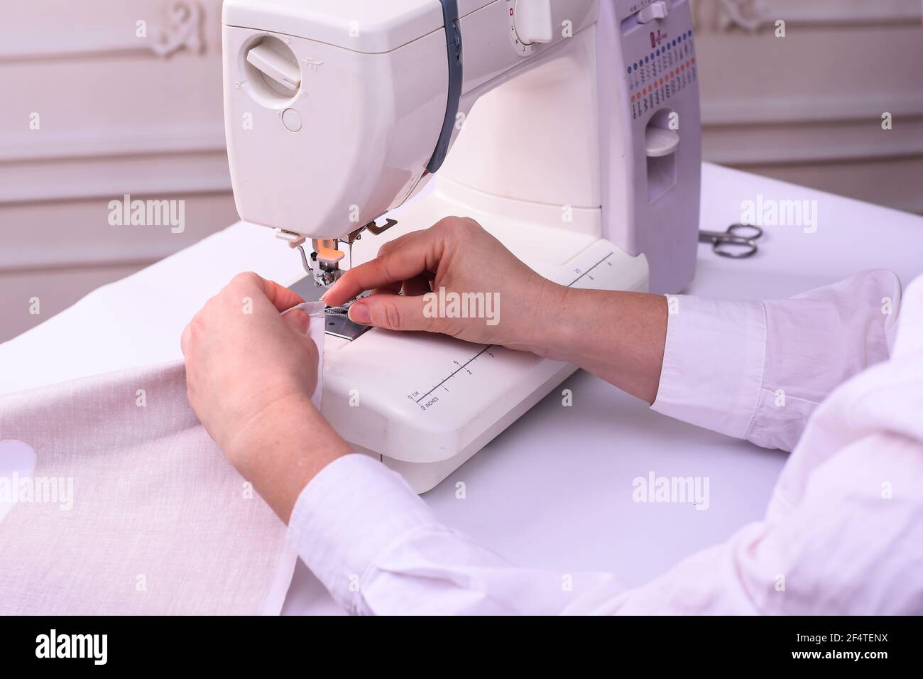 production of bed linen on a sewing machine.  Stock Photo