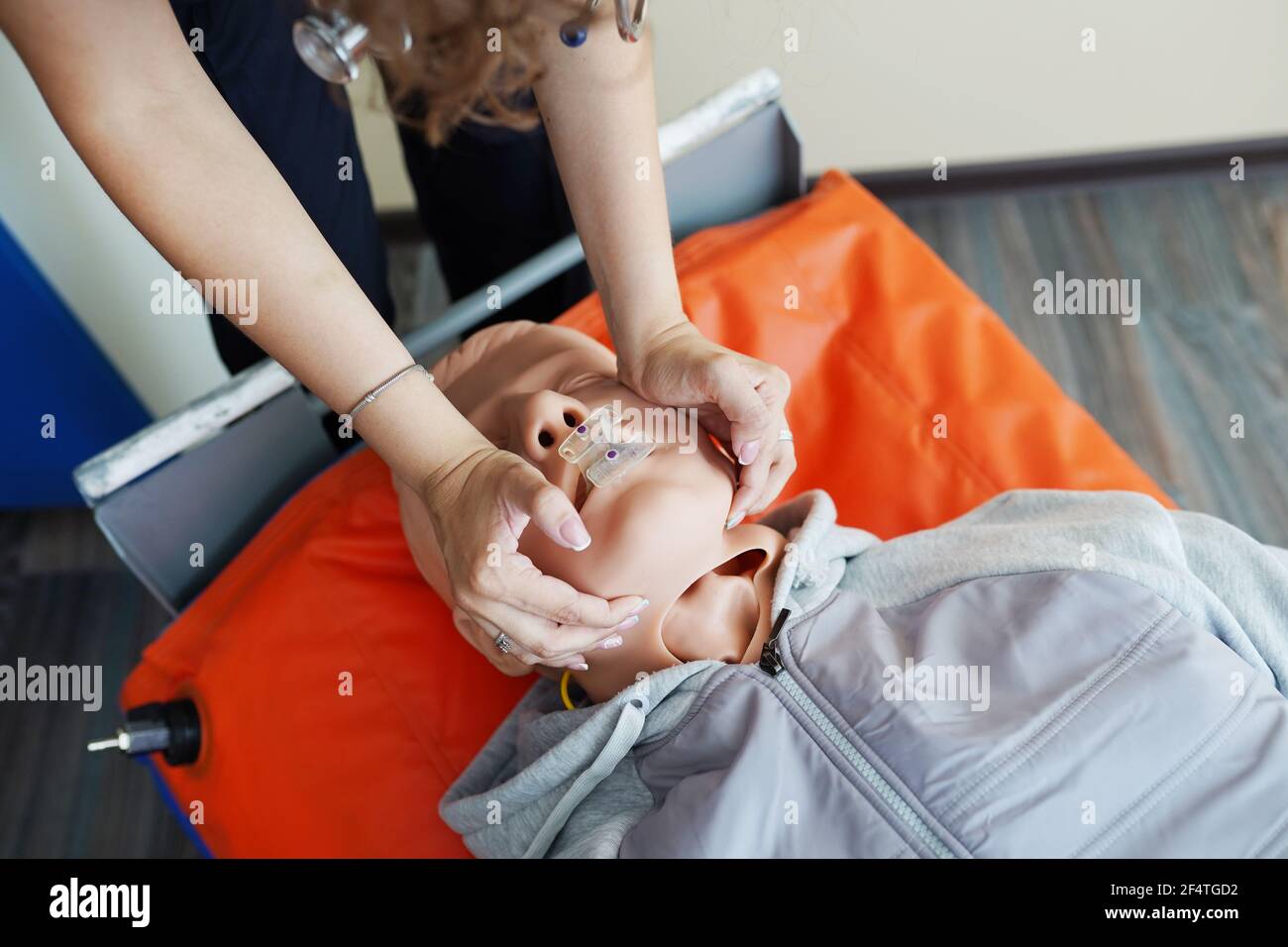 Nursing students are learning how to rescue the patients in emergency. CPR training with CPR doll. Stock Photo
