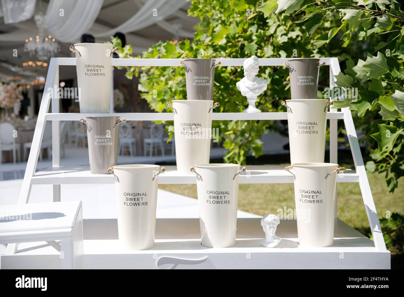 Empty large vases stand on a rack Stock Photo - Alamy