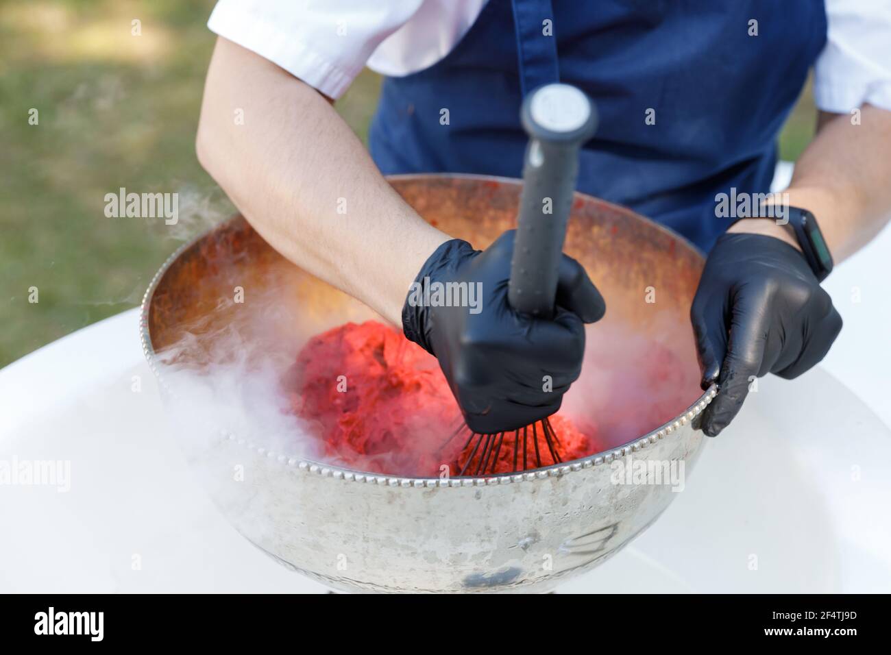 Close up of an ice cream maker preparing a berry and cream. Summertime Stock Photo