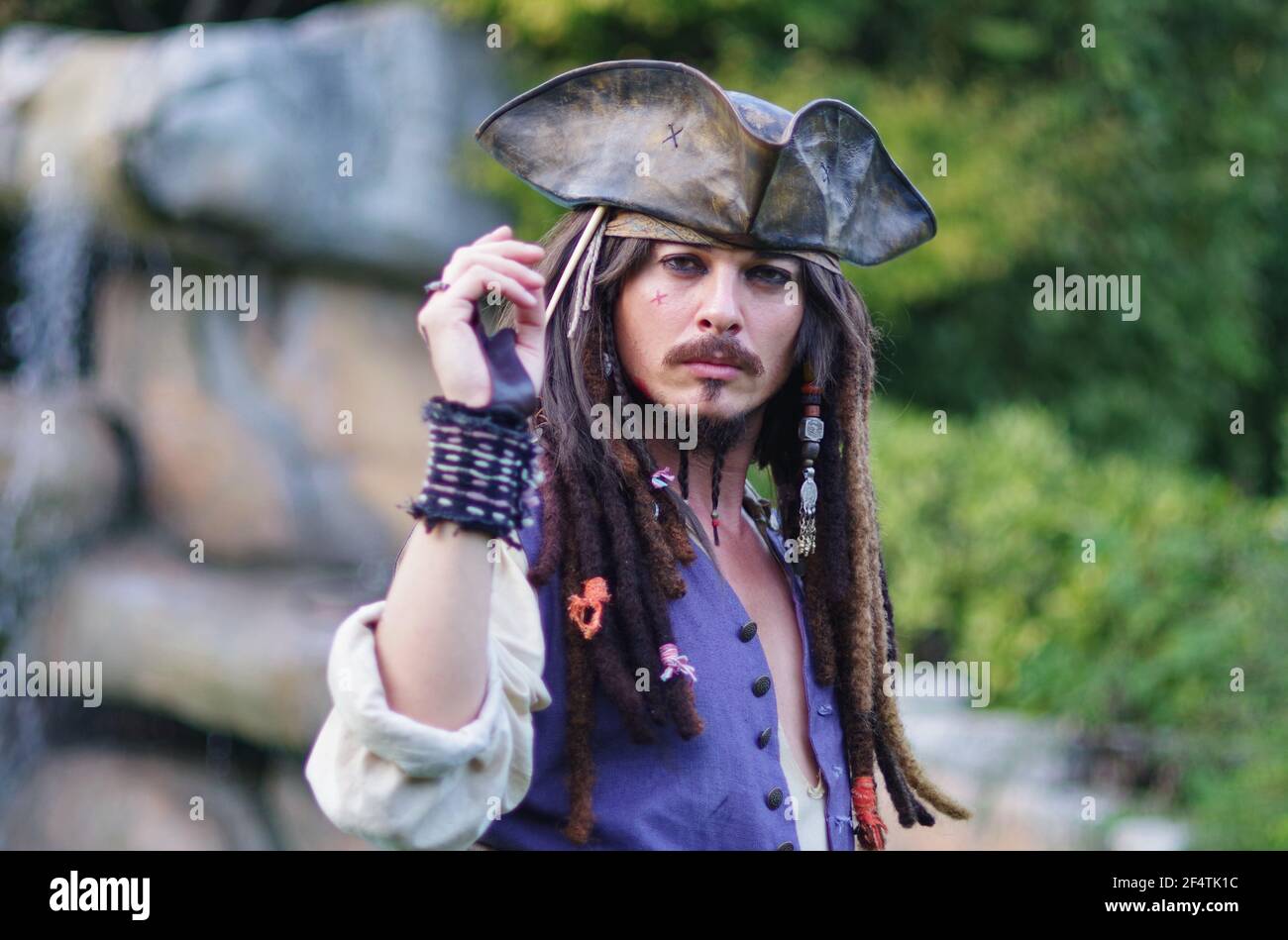 Actor posing for photographers in person cosplay 'Captain Jack Sparrow' from Pirates of the Caribbean Stock Photo