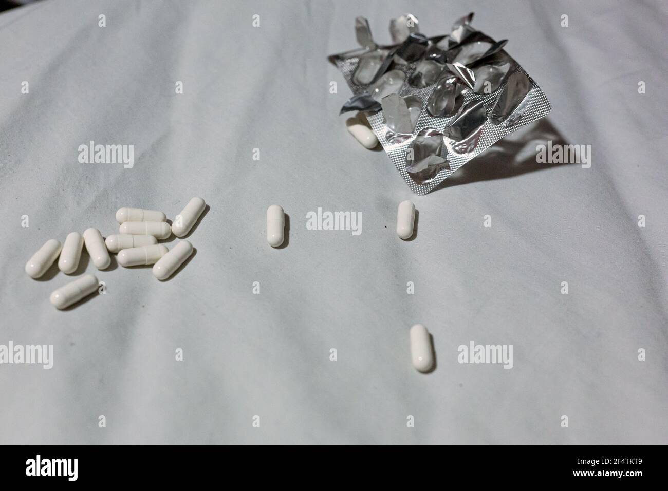 Close up of pain pills and an empty blister pack. Overdose, suicide, depression concept Stock Photo