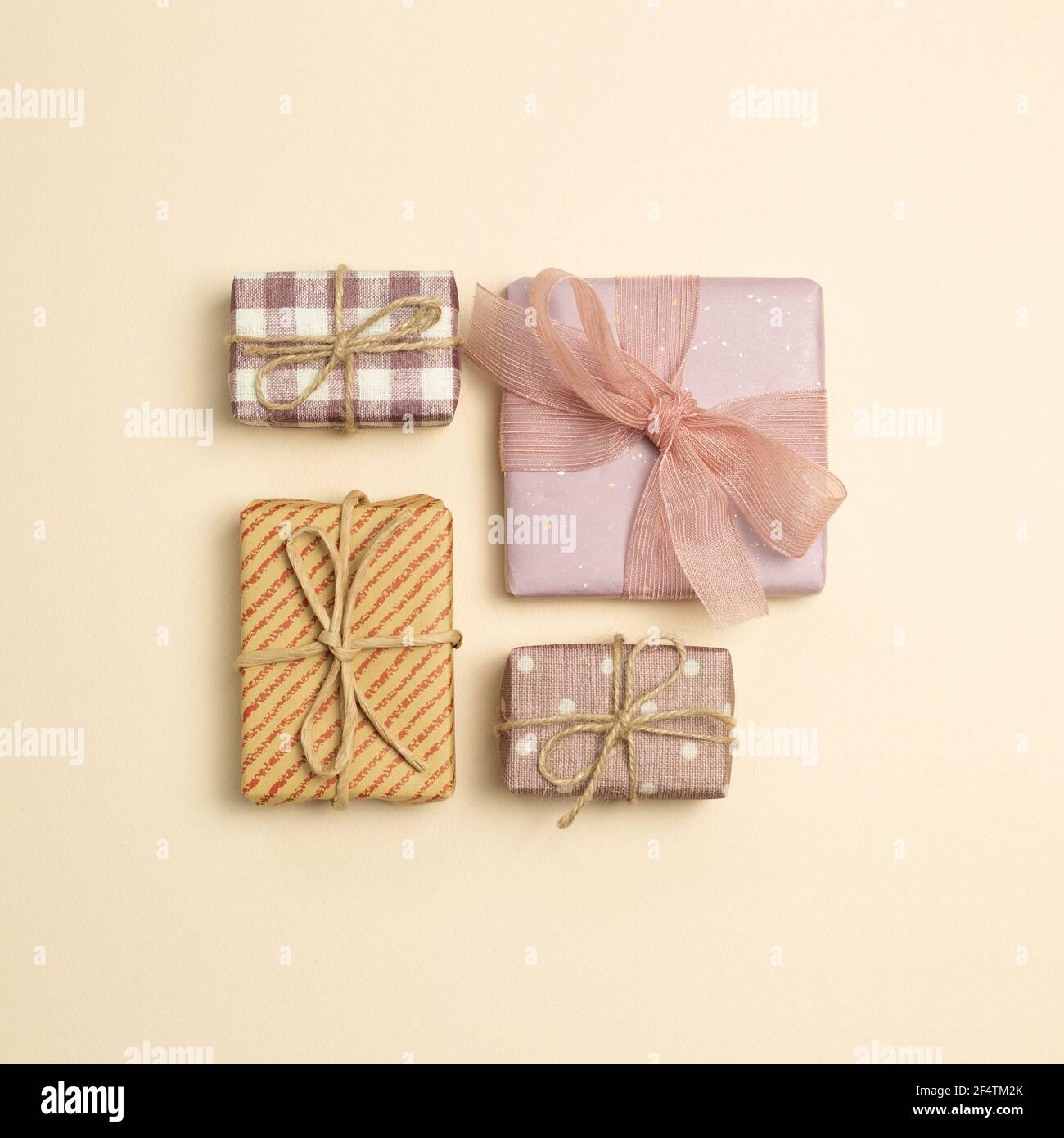 Gift boxes on beige background. flat lay, top view, copy space Stock Photo