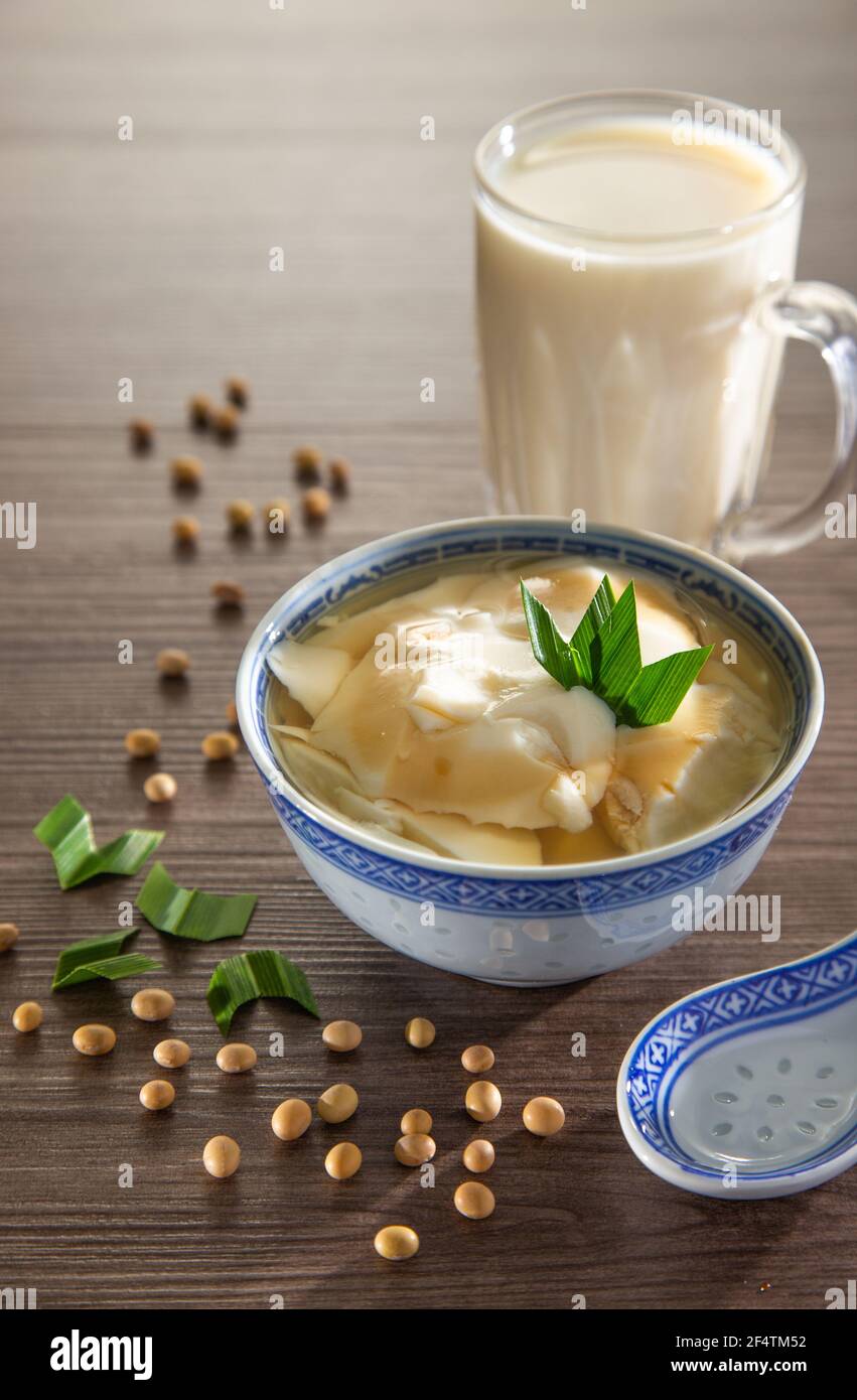 Tofu pudding dessert of soybean pudding in ginger and palm sugar syrup