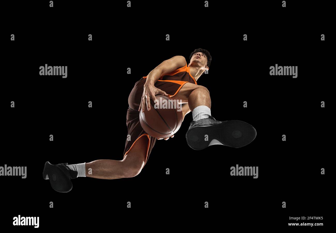 Young professional basketball player in action, motion isolated on ...