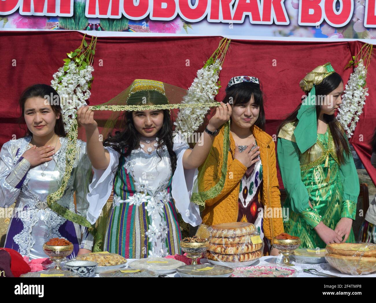 Jizzak Uzbekistan March 18 2018. National spring holiday Navruz. Young women demonstrate samples of national women s clothing Stock Photo Alamy