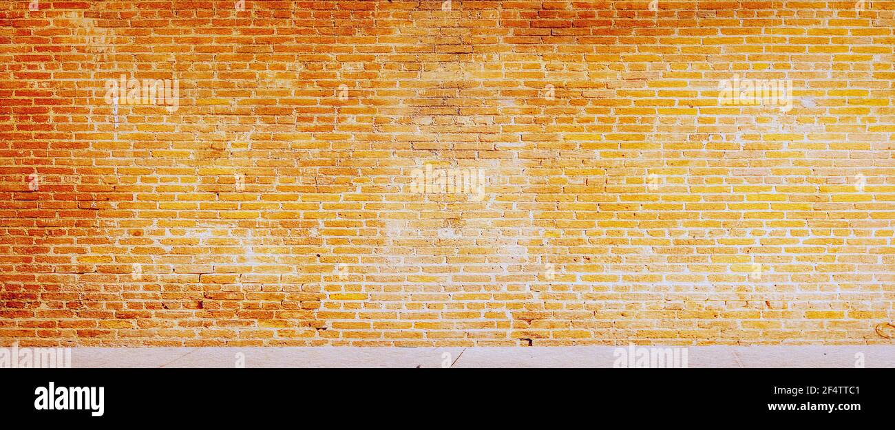 Grunge orange wall background. Grunge dirty old brick stone wall