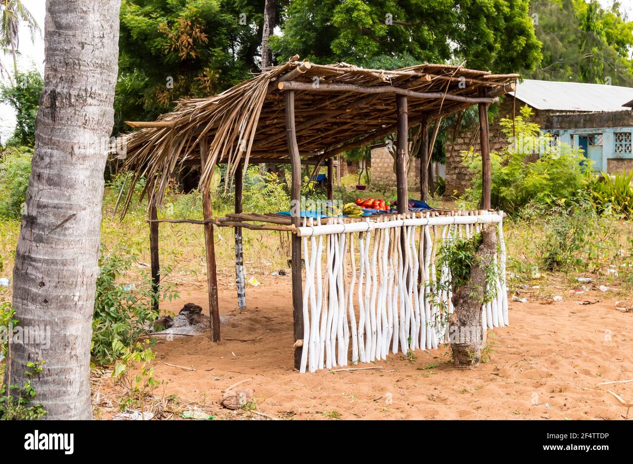 Small wooden stall with some tomatoes and bananas in the forest near Watamu in Kenya Stock Photo