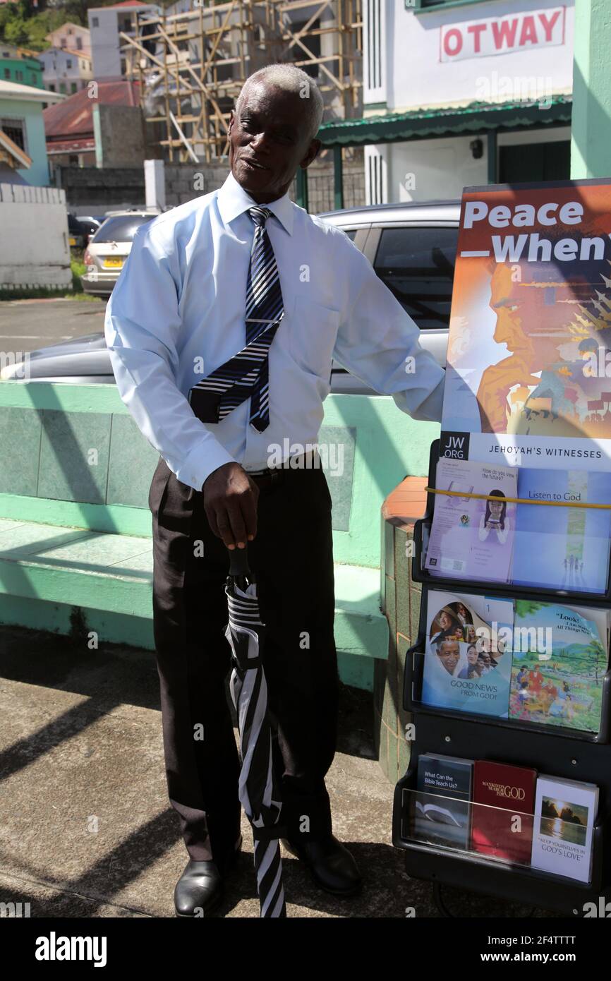 St George's Grenada The Carenage Jehovah witness With Leaflets on Street Stock Photo