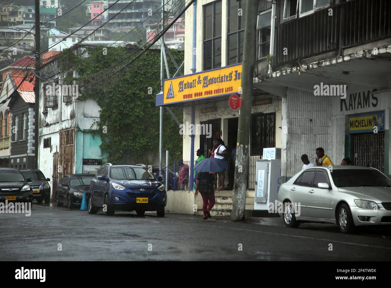 South St George Grenada People Walking in Rain Stock Photo