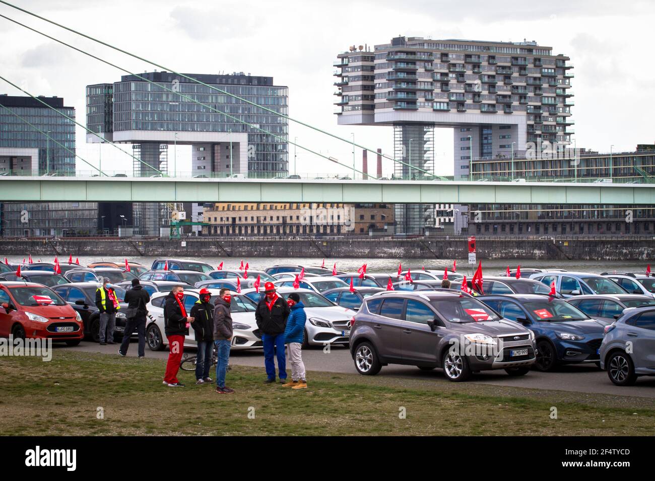 IG Metall (Industrial Union of Metalworkers) warning strike rally on March 17, 2021 on the banks of the Rhine in the Deutz district, participants stay Stock Photo