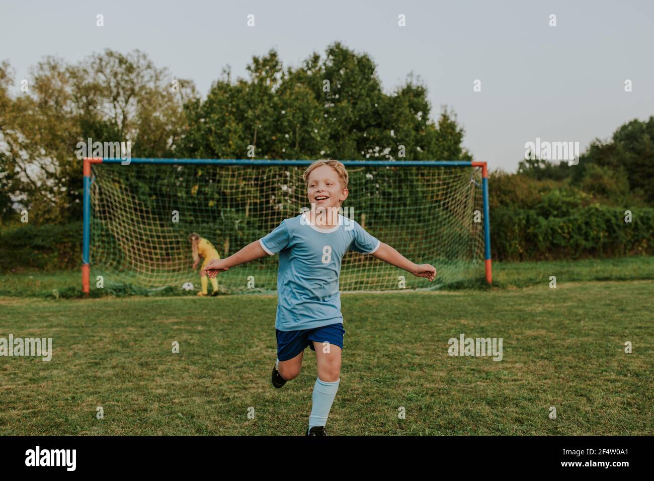 Child scoring goal hires stock photography and images Alamy