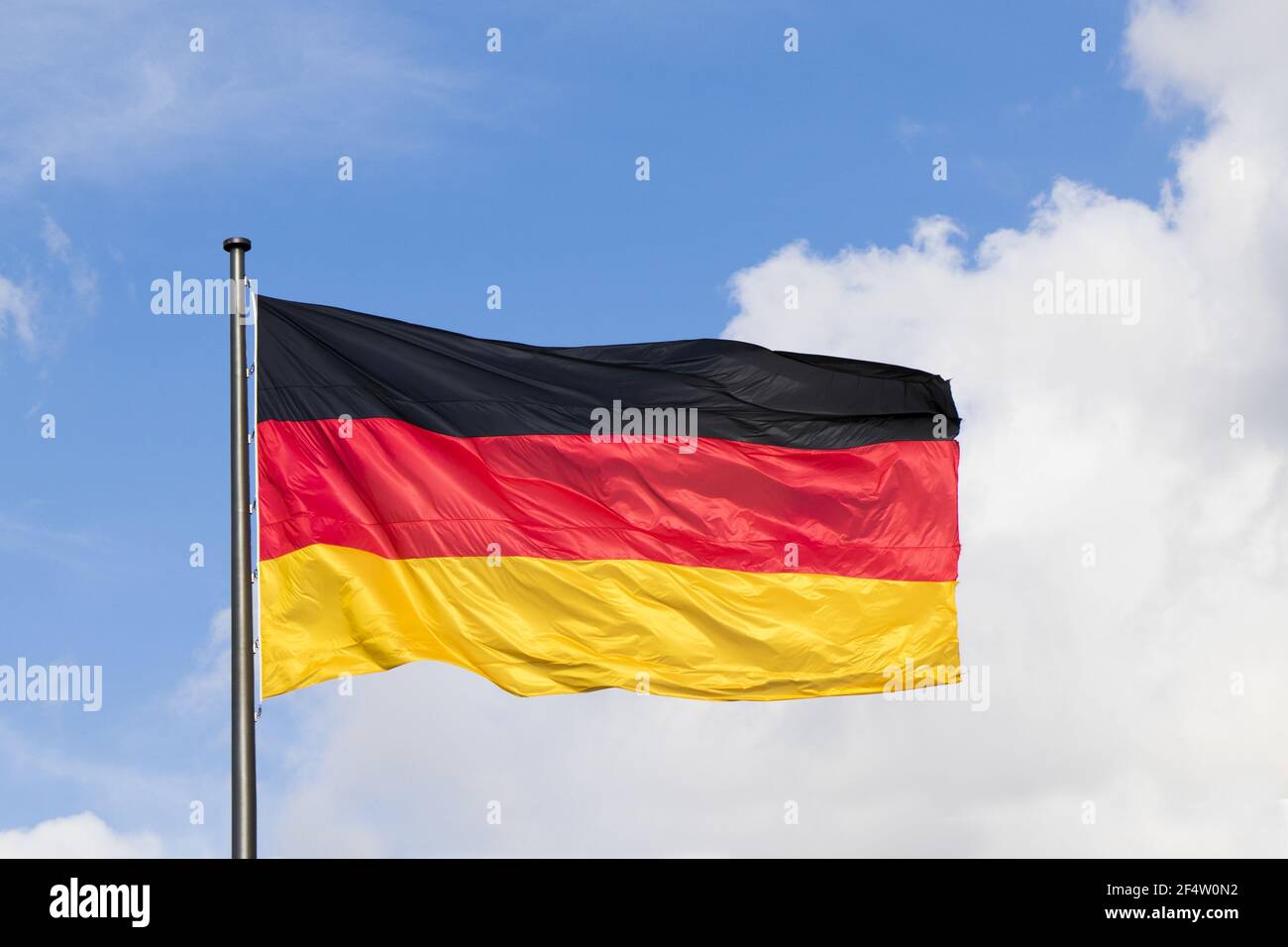 German flag on blue sky background Stock Photo