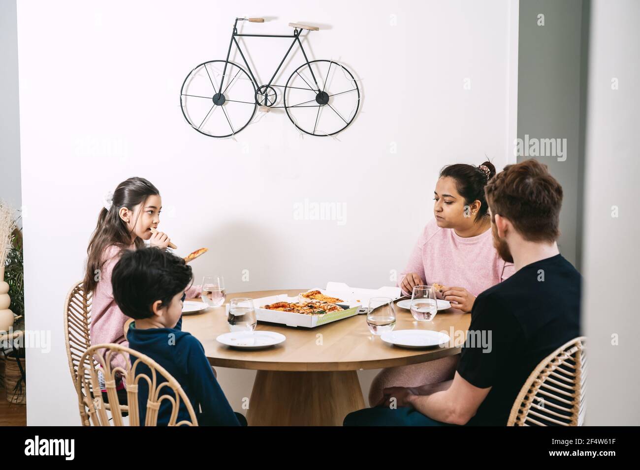 Multinational family eating pizza at home Stock Photo