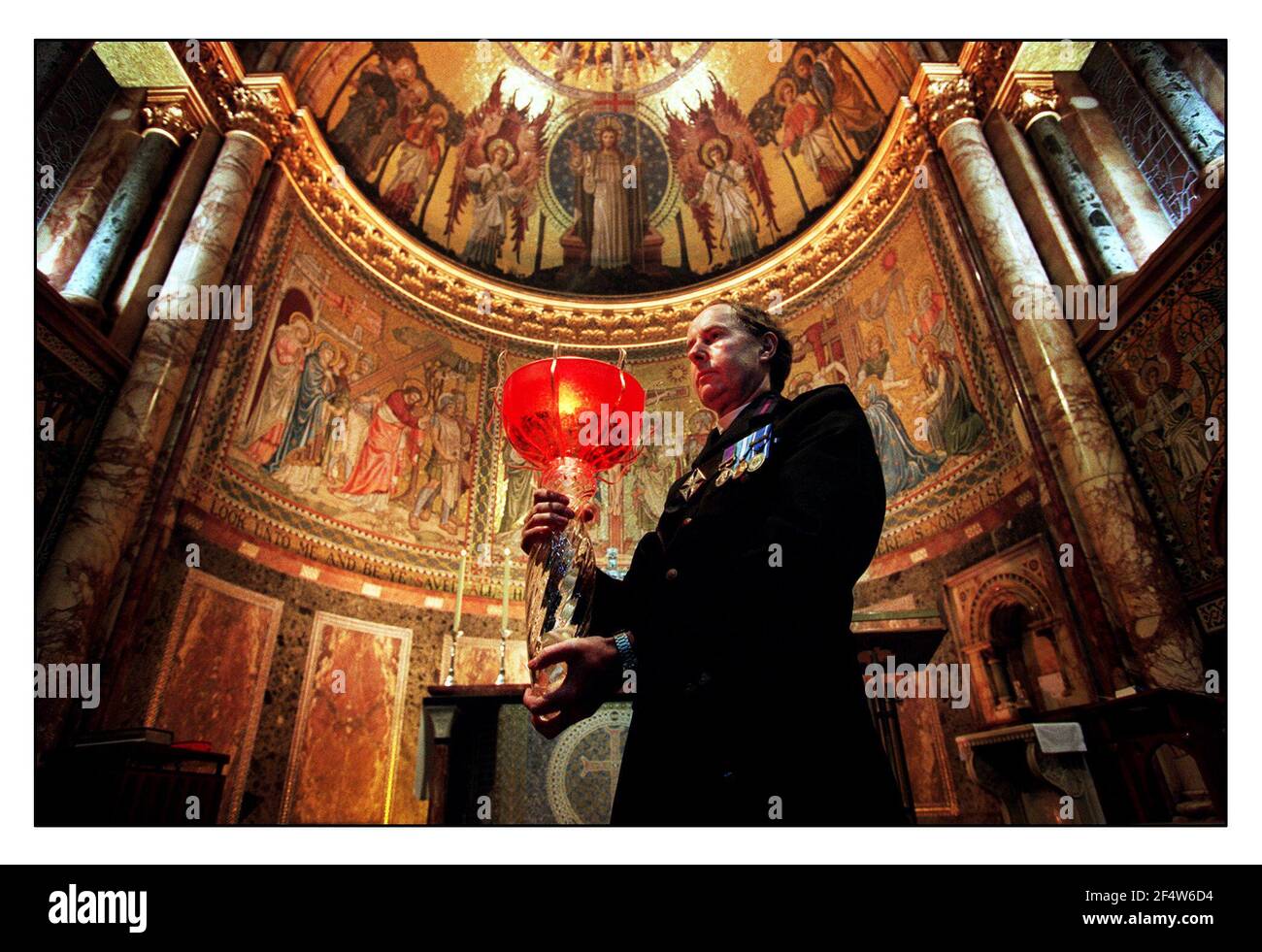 The Reverend Leslie H Bryan C.F. December 1999Senior Chaplain The Household Division with the Beacon Millennium Flame. The flame was Brought from Sunderland  and kept in the Guards Chapel at Wellington Barracks untill the afternoon of the 31st. December. Stock Photo