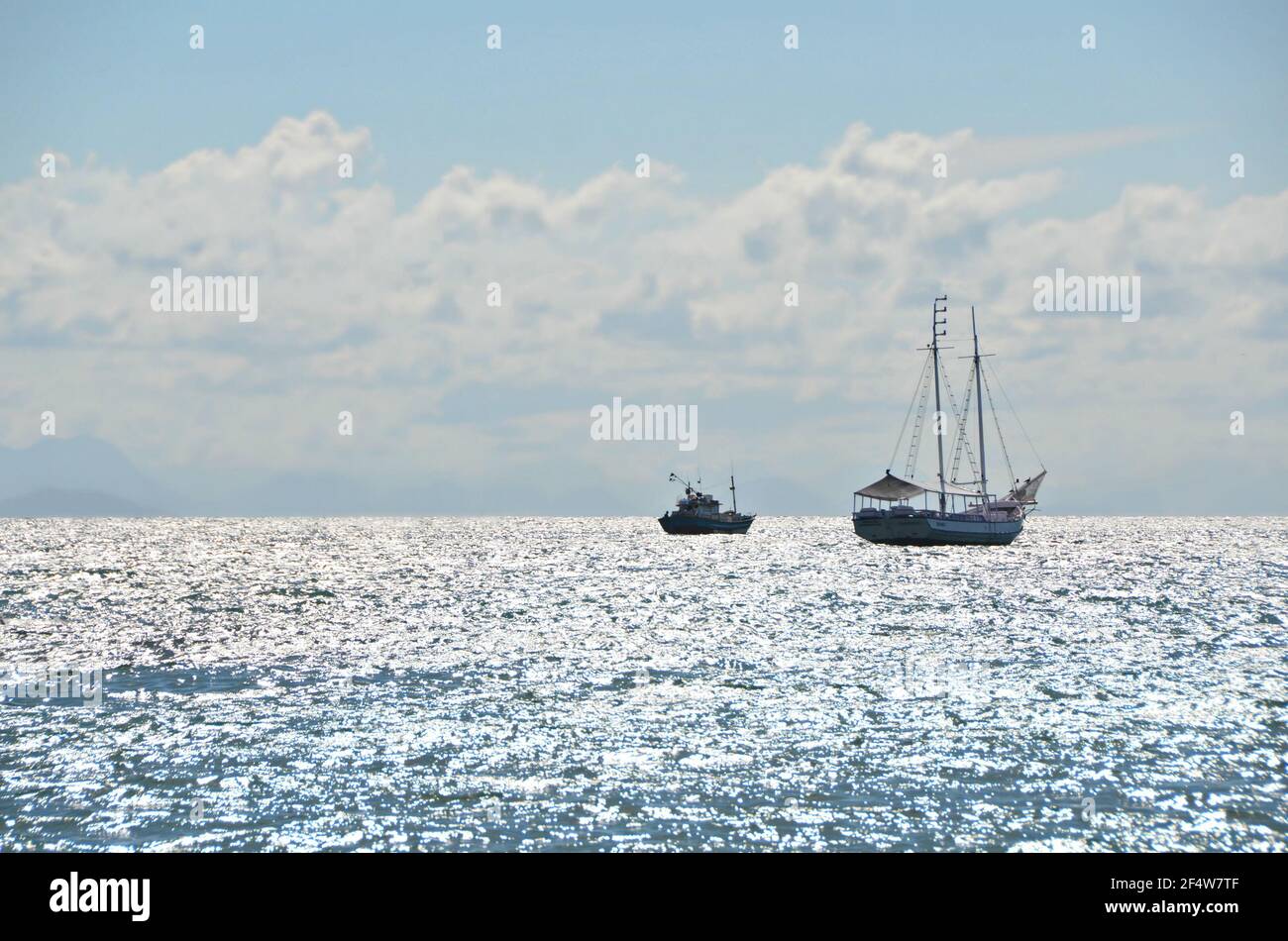 Landscape with view of a traditional sightseeing Schooner on the waters of Armação dos Búzios, the renown resort town of Rio de Janeiro, Brazil. Stock Photo