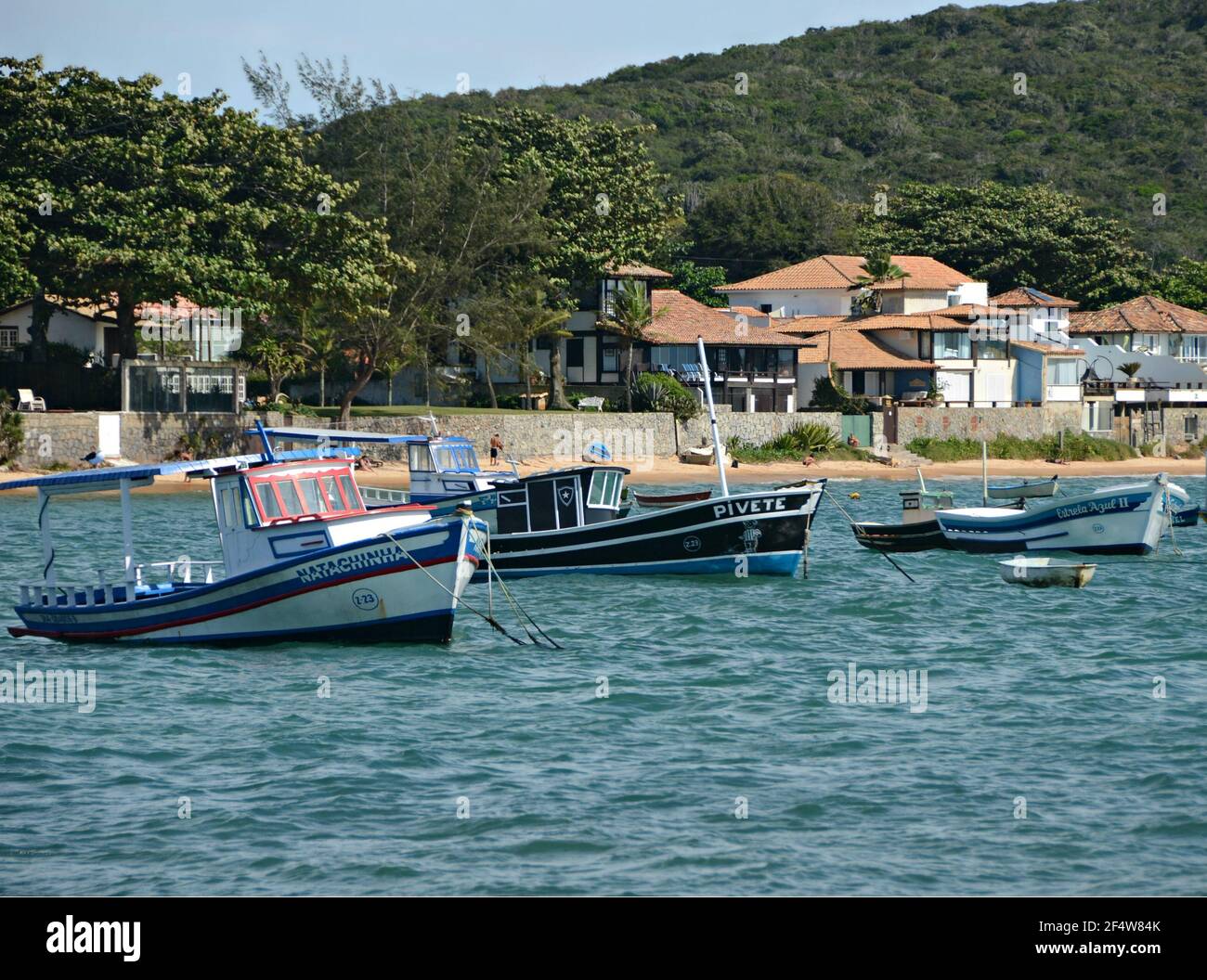 Landscape with view of traditional fishing boats on the waters of Armação dos Búzios, the renown resort town of Rio de Janeiro, Brazil. Stock Photo