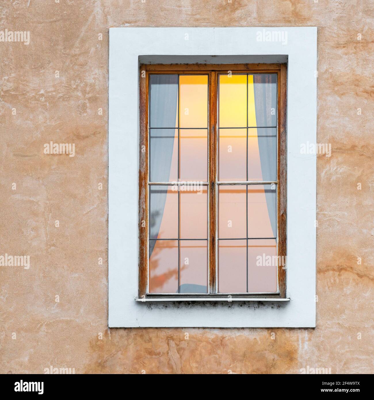 Romanesque style architecture facade with window and interior atmosphere light, Prague city, Czech Republic. Stock Photo