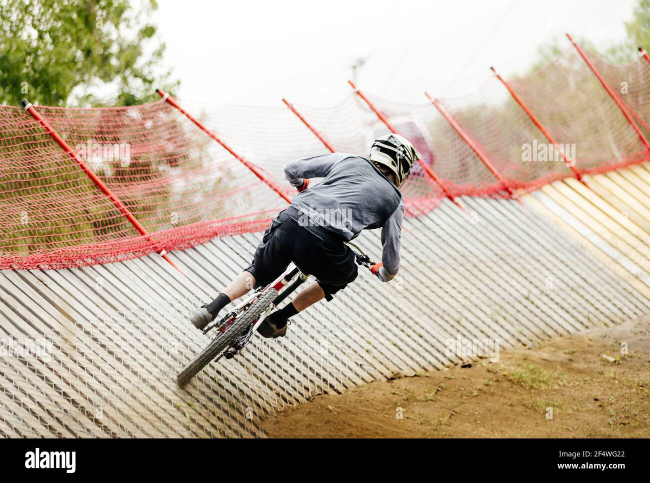 back athlete rider downhill wallride turn Stock Photo - Alamy