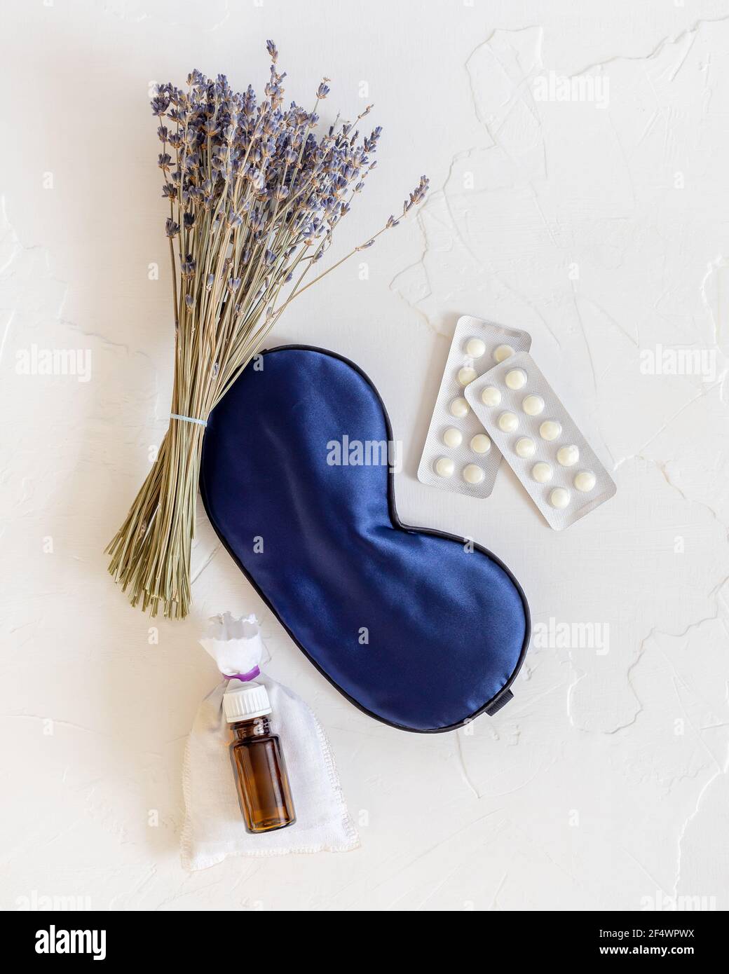 Flat lay composition with lavender flowers, oil, mask for sleep ...