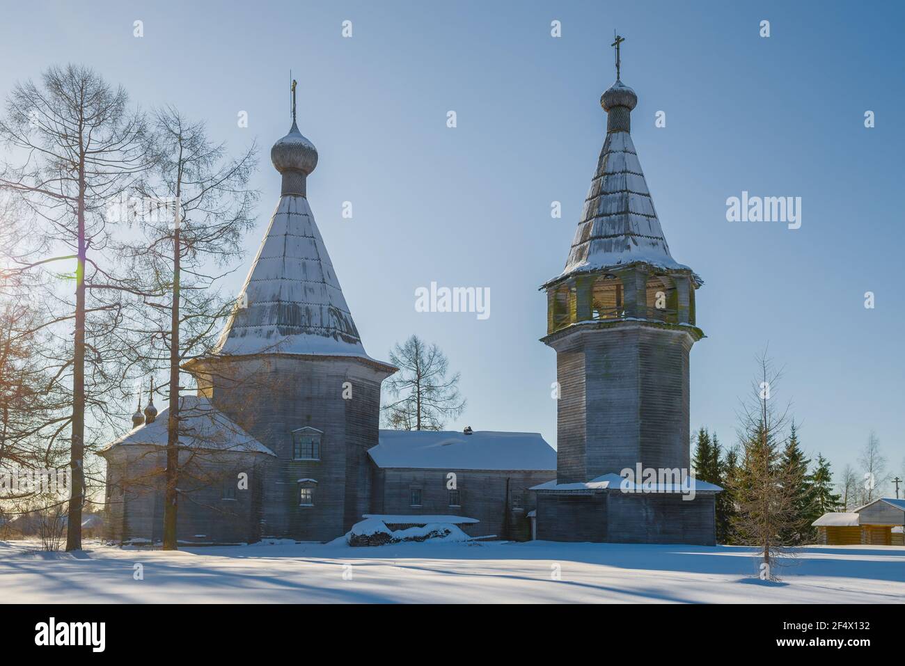 Old wooden church of the Epiphany on February afternoon. Pogost (Oshevenskoe). Arkhangelsk region, Russia Stock Photo