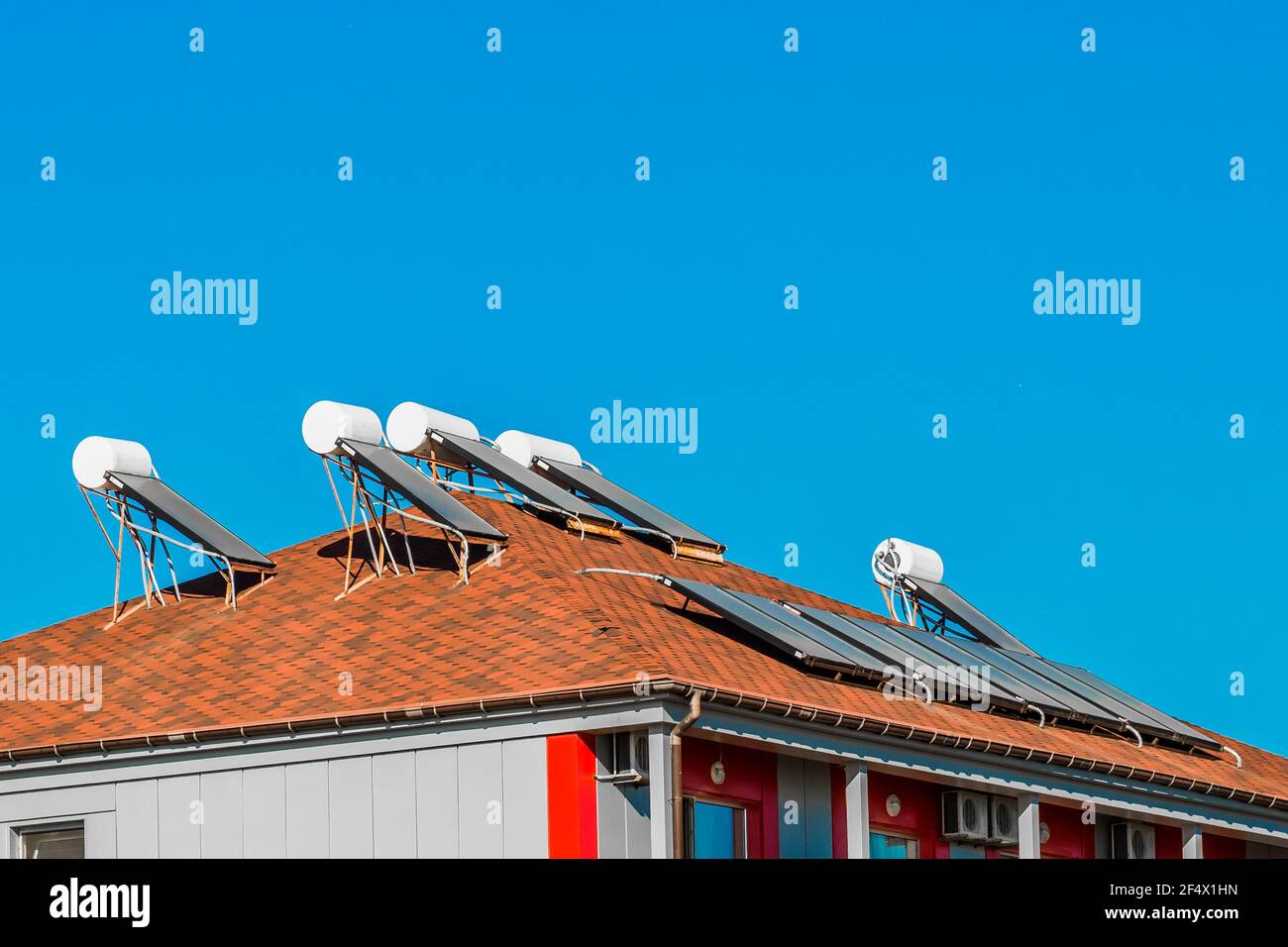 Solar water heater on the roof of a building against the background of ...