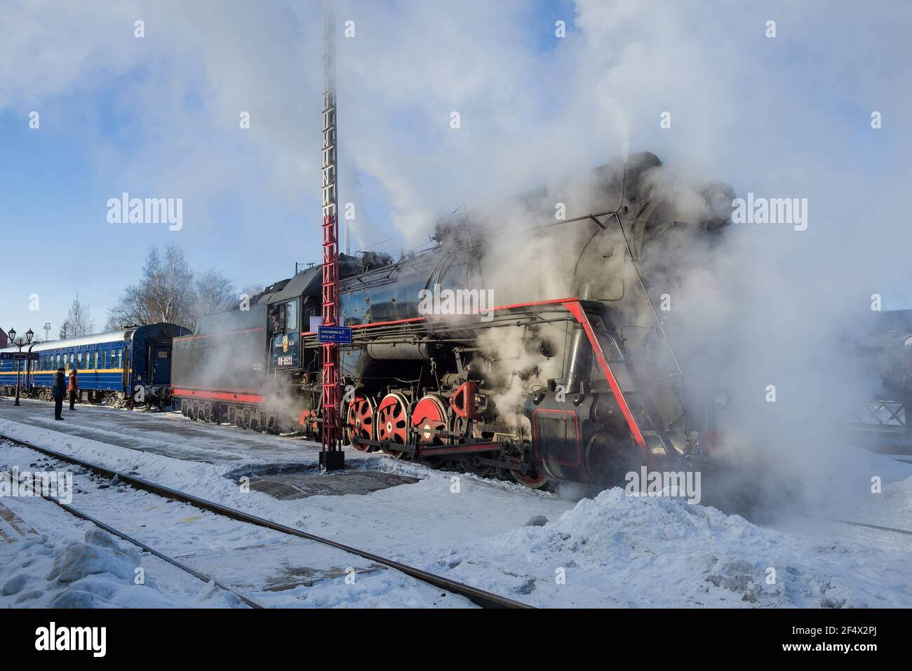 SORTAVALA, RUSSIA - MARCH 10, 2021: Delivery of a steam locomotive to the tourist retro train 'Ruskeala Express' on a March morning Stock Photo