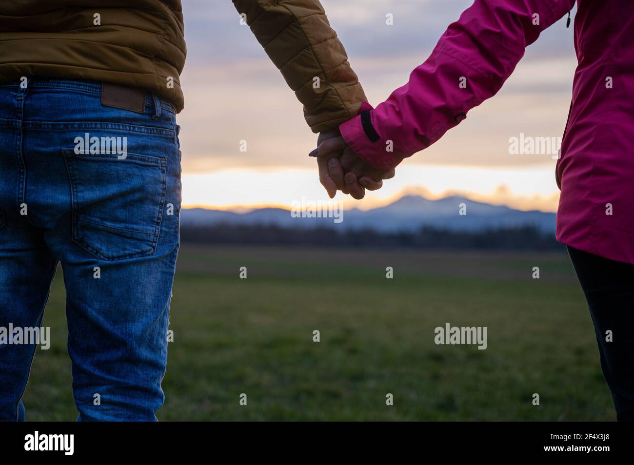 Closeup couple holding hands walking hi-res stock photography and ...