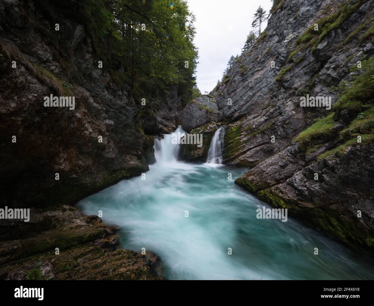 Long exposure panorama of Stromboding waterfall rapids cascade in azure blue turquoise alpine mountain river Steyr Tiefenthal Hinterstoder Upper Austr Stock Photo