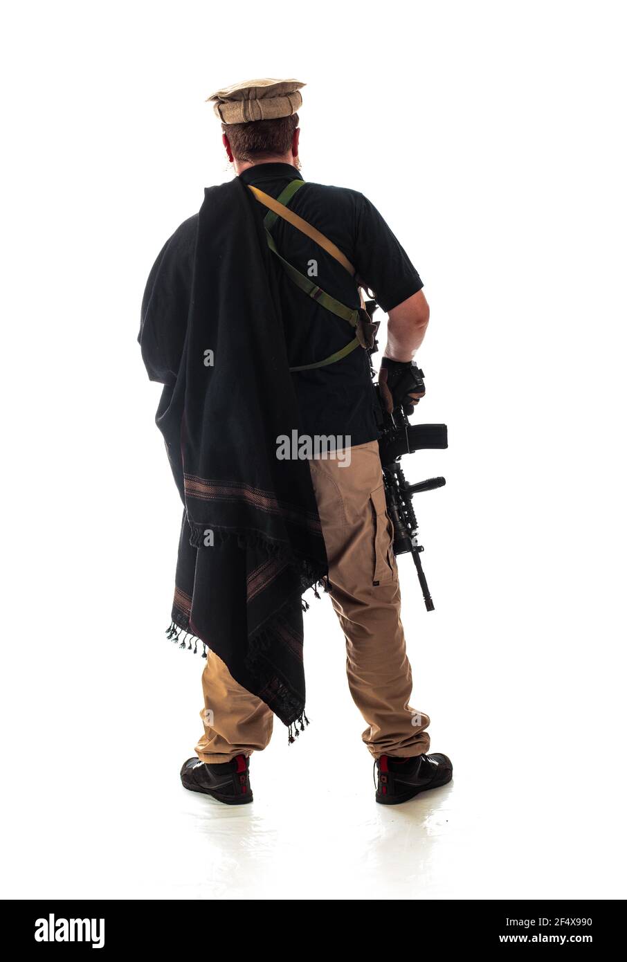 man in military outfit CIA agent, which is similar to the clothing of a  warrior Mujahedin, in modern times on a white background in studio Stock  Photo - Alamy