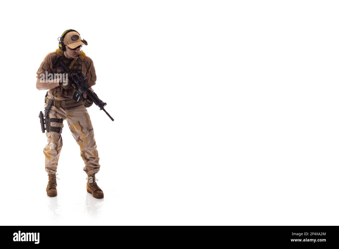 man military outfit a mercenary soldier in modern times on a white background in studio Stock Photo