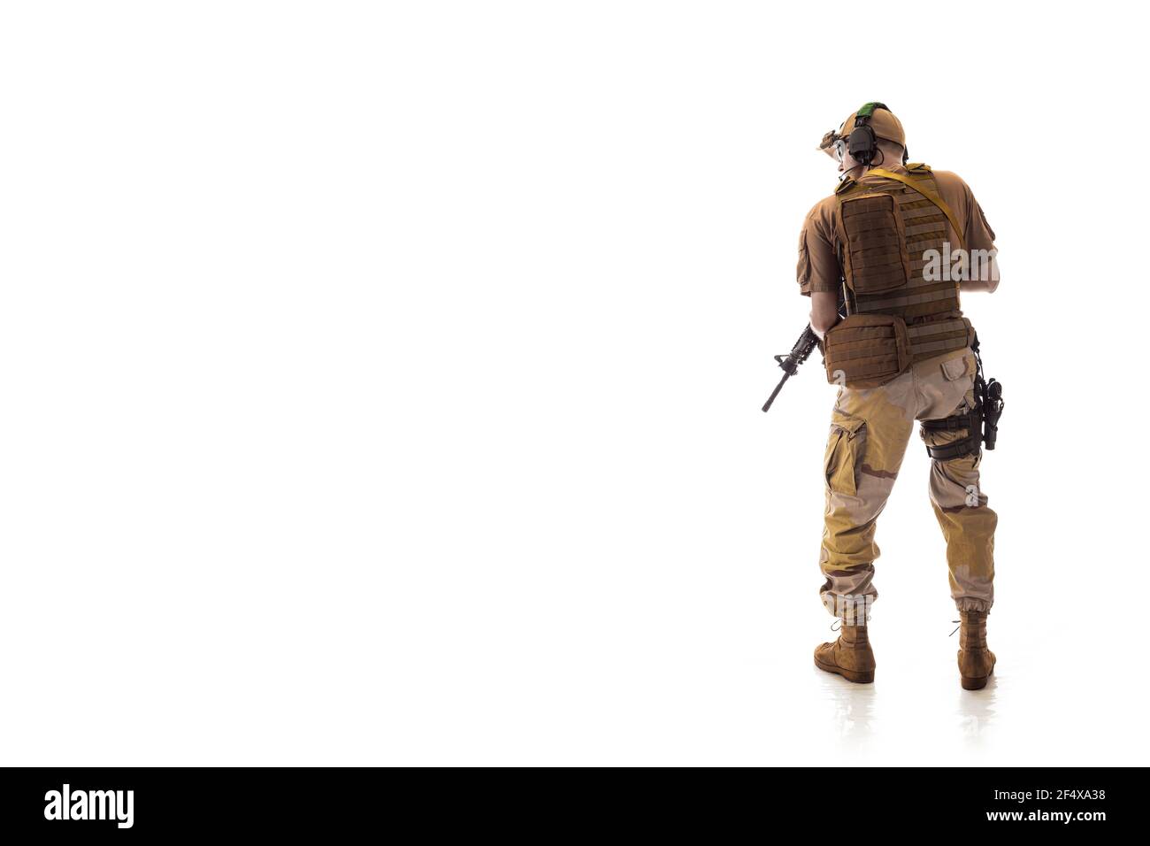 man military outfit a mercenary soldier in modern times on a white background in studio Stock Photo