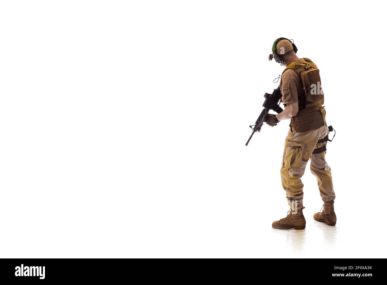 man military outfit a mercenary soldier in modern times on a white background in studio Stock Photo