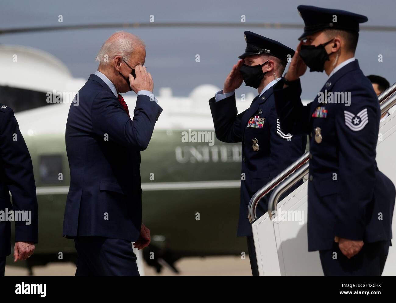 U.S. President Joe Biden returns a salute while boarding Air Force One as  he departs Washington on travel to Columbus, Ohio to promote the $1.9  trillion coronavirus disease (COVID-19) aid package known