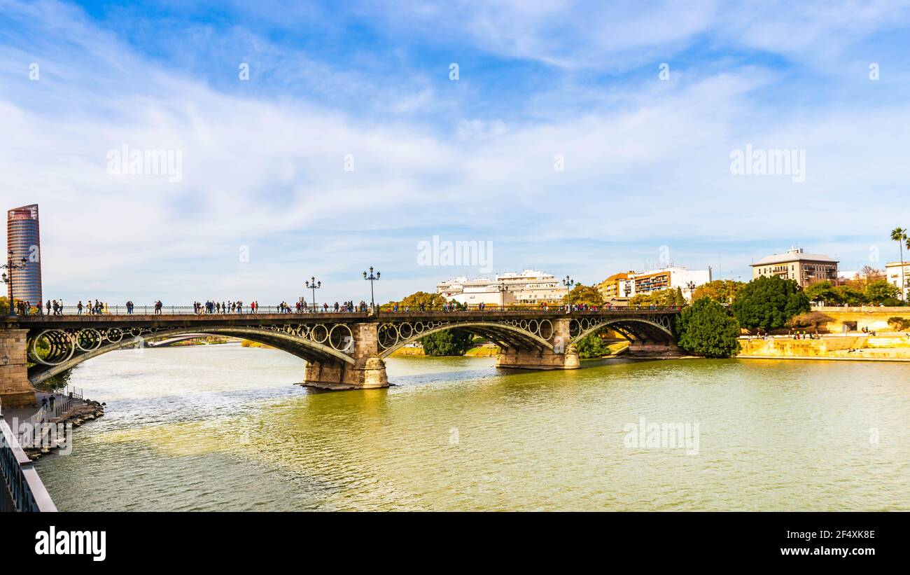 The Isabel II Bridge on the Guadalquivir River in Seville, Andalusia, Spain Stock Photo