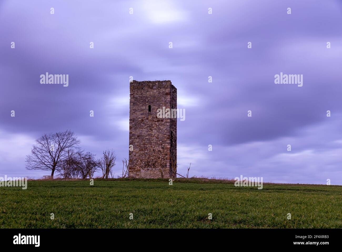 Magdeburg, Germany. 21st Mar, 2021. The 'Blaue Warte' between Wanzleben and Oschersleben is one of the oldest structures in the Magdeburger Börde. The watchtower was built of field stones in 1438 as a border marker between the areas settled by Germanic and Slavic peoples. Only two other watchtowers from this period have survived in Saxony-Anhalt. Credit: Stephan Schulz/dpa-Zentralbild/ZB/dpa/Alamy Live News Stock Photo