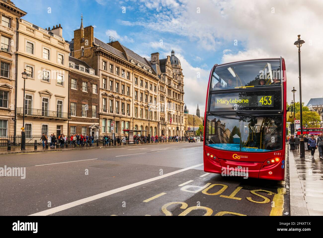 Street in the center with a typical red bus in London in England, UK Stock Photo