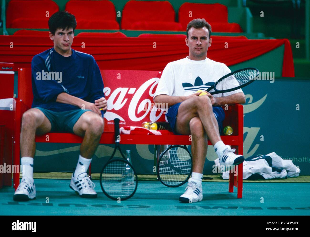 English tennis player Tim Henman pictured kissing a ball girl