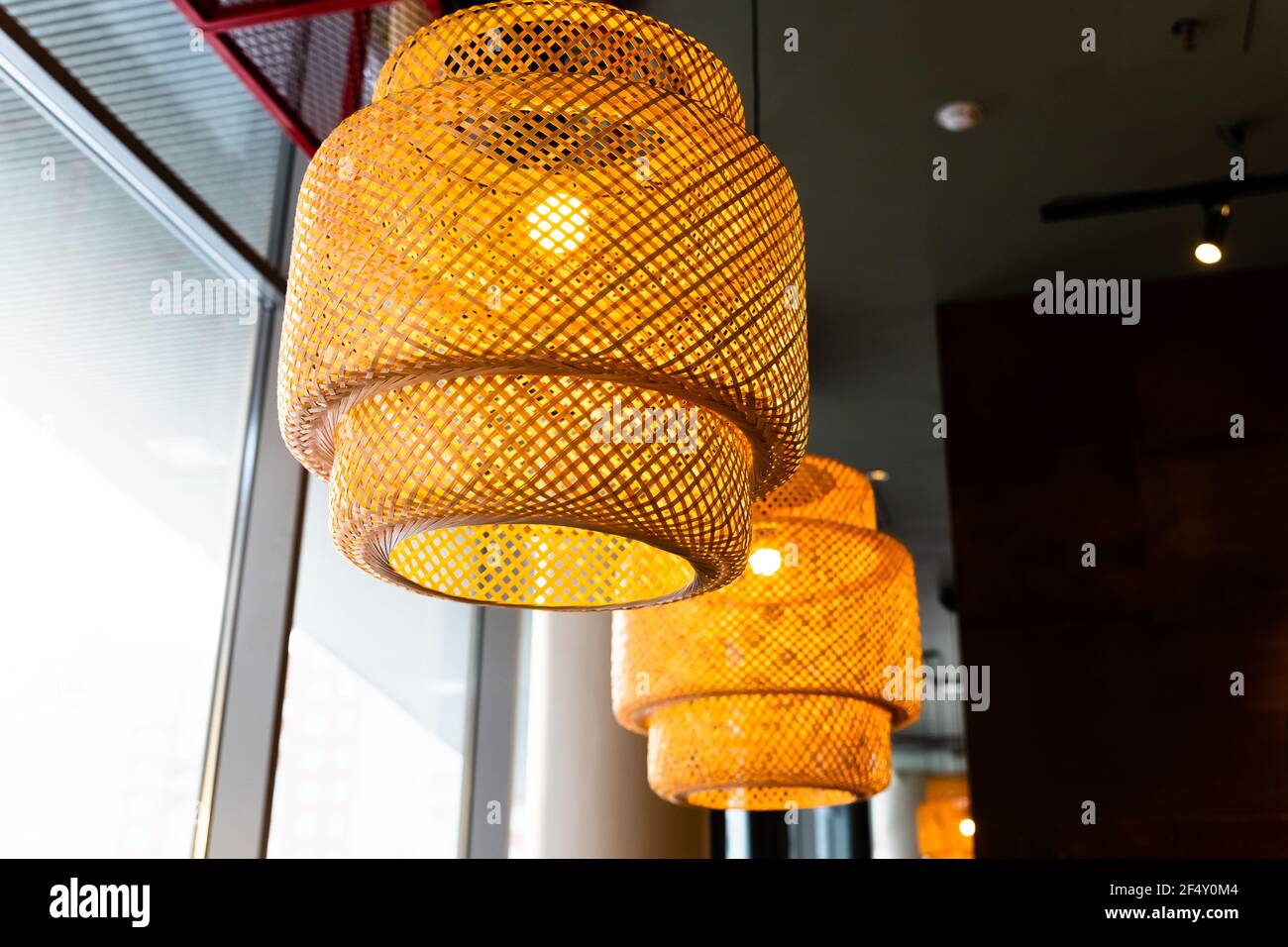 Decorating hanging lantern lamps in wooden wicker made from bamboo.Asian  style.Pendant light with wicker lampshade, rustic style Stock Photo - Alamy