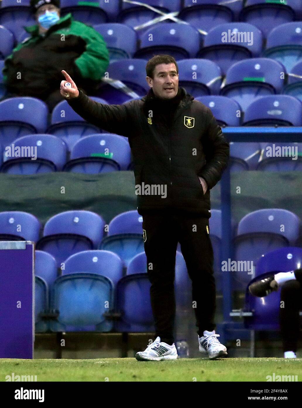 Mansfield Town manager Nigel Clough gestures on the touchline during the Sky Bet League Two match at the One Call Stadium, Mansfield. Picture date: Tuesday March 23, 2021. Stock Photo
