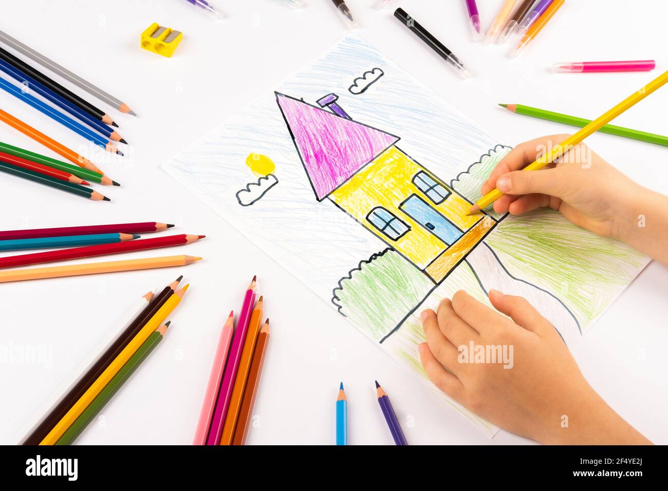 https://c8.alamy.com/comp/2F4YE2J/child-girl-draws-house-on-a-white-sheet-2F4YE2J.jpg