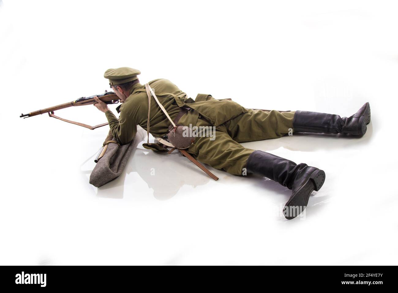 Male actor in the form of an ordinary soldier of the Russian army during the First World War posing against a white background in the studio Stock Photo