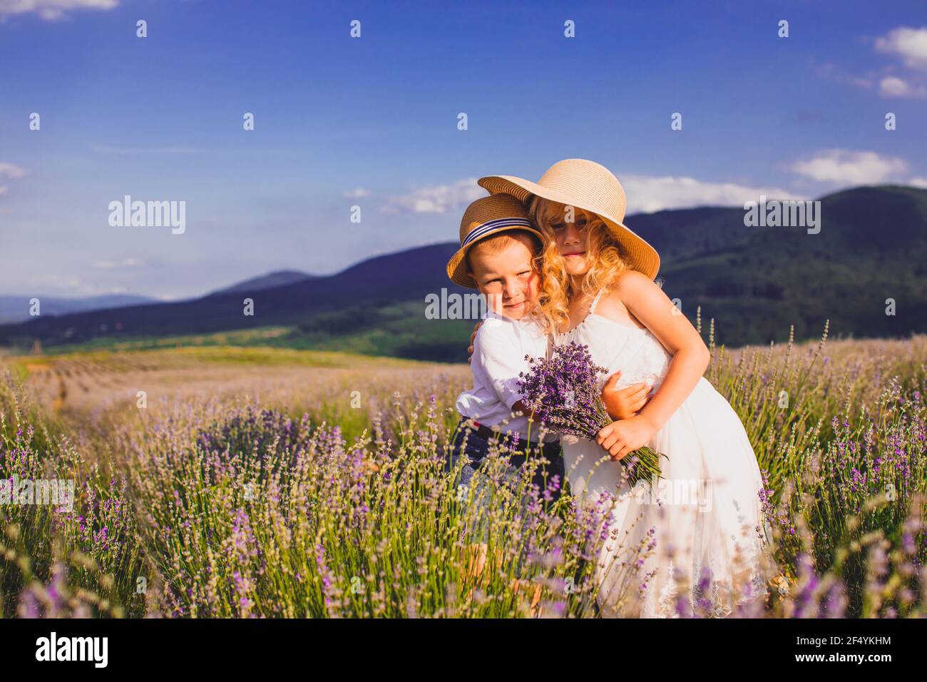Two adorable kids, boy and girl, standing together Stock Photo - Alamy