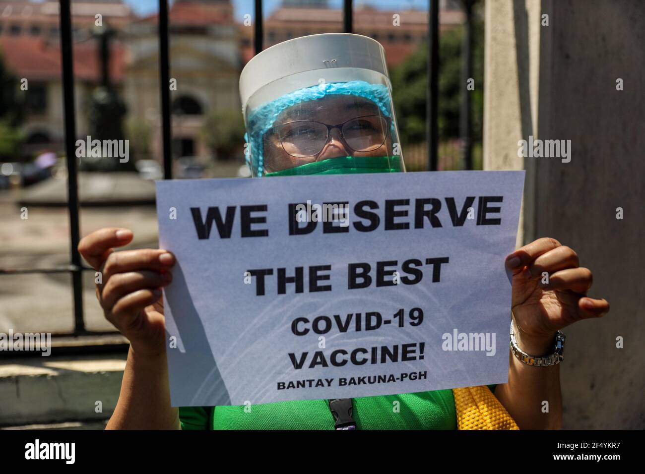 Healthcare workers call for a free, safer and effective COVID-19 vaccine during a protest outside the Philippine General Hospital in Manila. Activists along with medical workers and students demanded for a free and safer COVID-19 vaccine for health care workers, who continue to be at risk amid the surge of coronavirus cases in the country. The government, meanwhile, faced criticism for failing to immediately launch a vaccination program, leaving the Philippines the only ASEAN member with no COVID-19 vaccines that is expected to arrive in late February. Philippines. Stock Photo